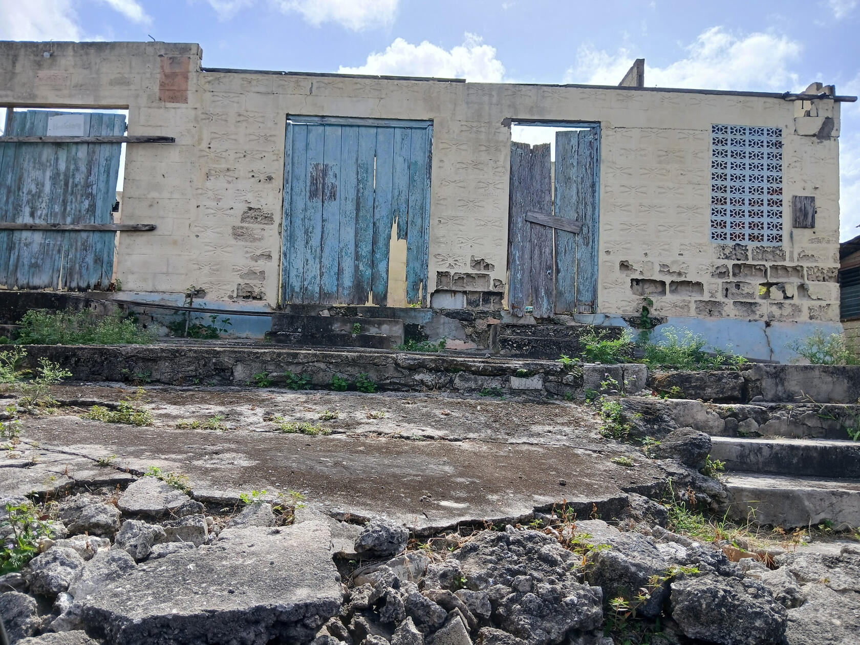 Derelict houses and crumbling sidewalks